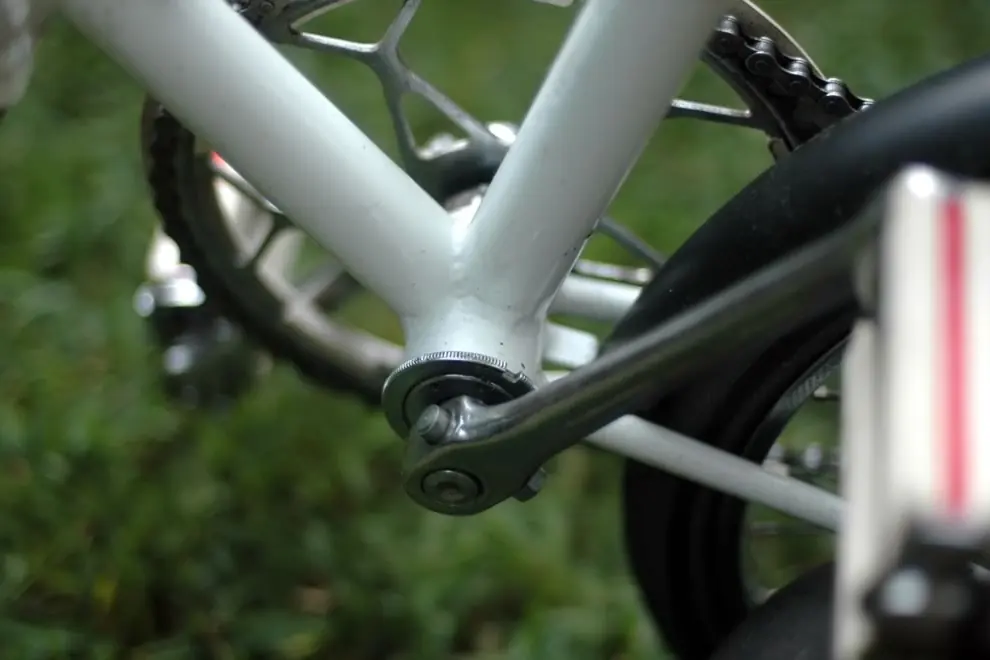 Crank arm attached to the frame at the bottom bracket